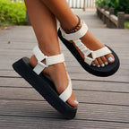 Rear angle of metallic multicolour platform sandals highlighting the stretch-back ankle strap