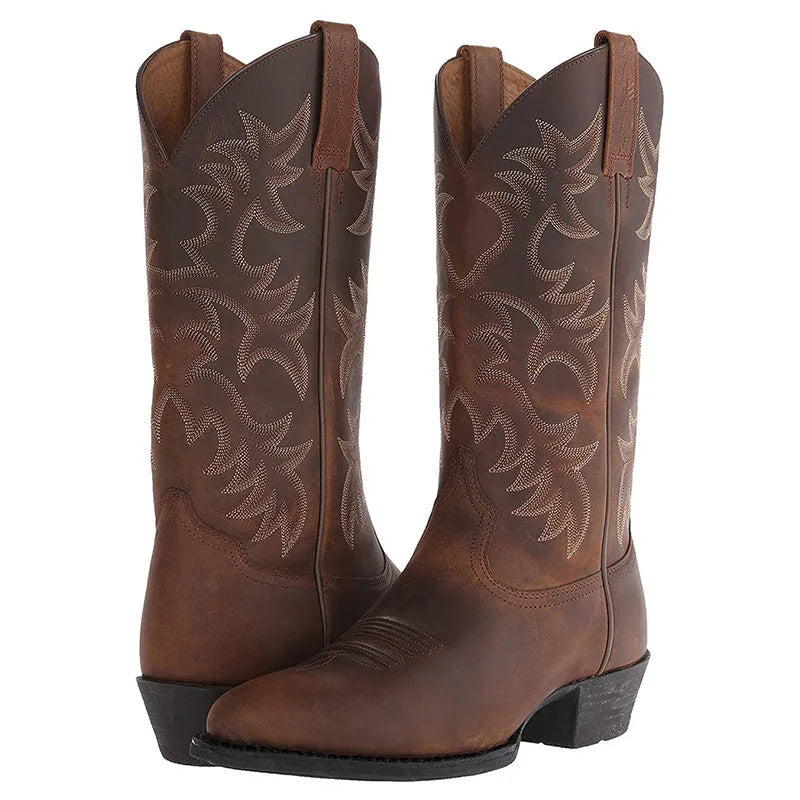 Angled view of the toe box and vamp stitching on a brown leather western boot