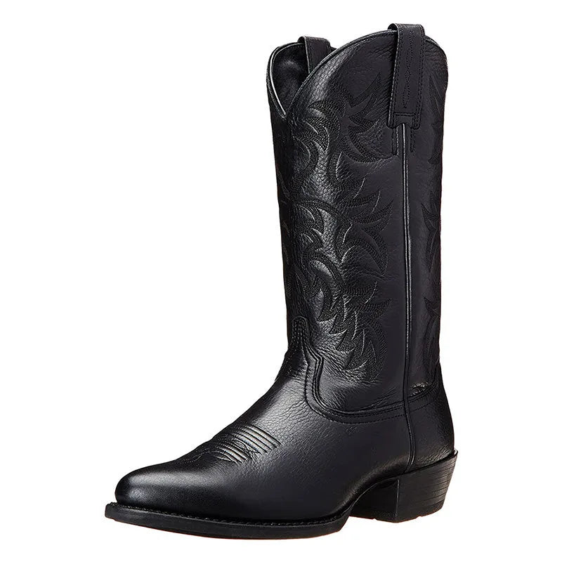Three-quarter angled view of a black leather cowboy boot highlighting the embroidered shaft pattern
