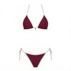 Flat lay of navy bikini set laid out showing full coverage and binding detail