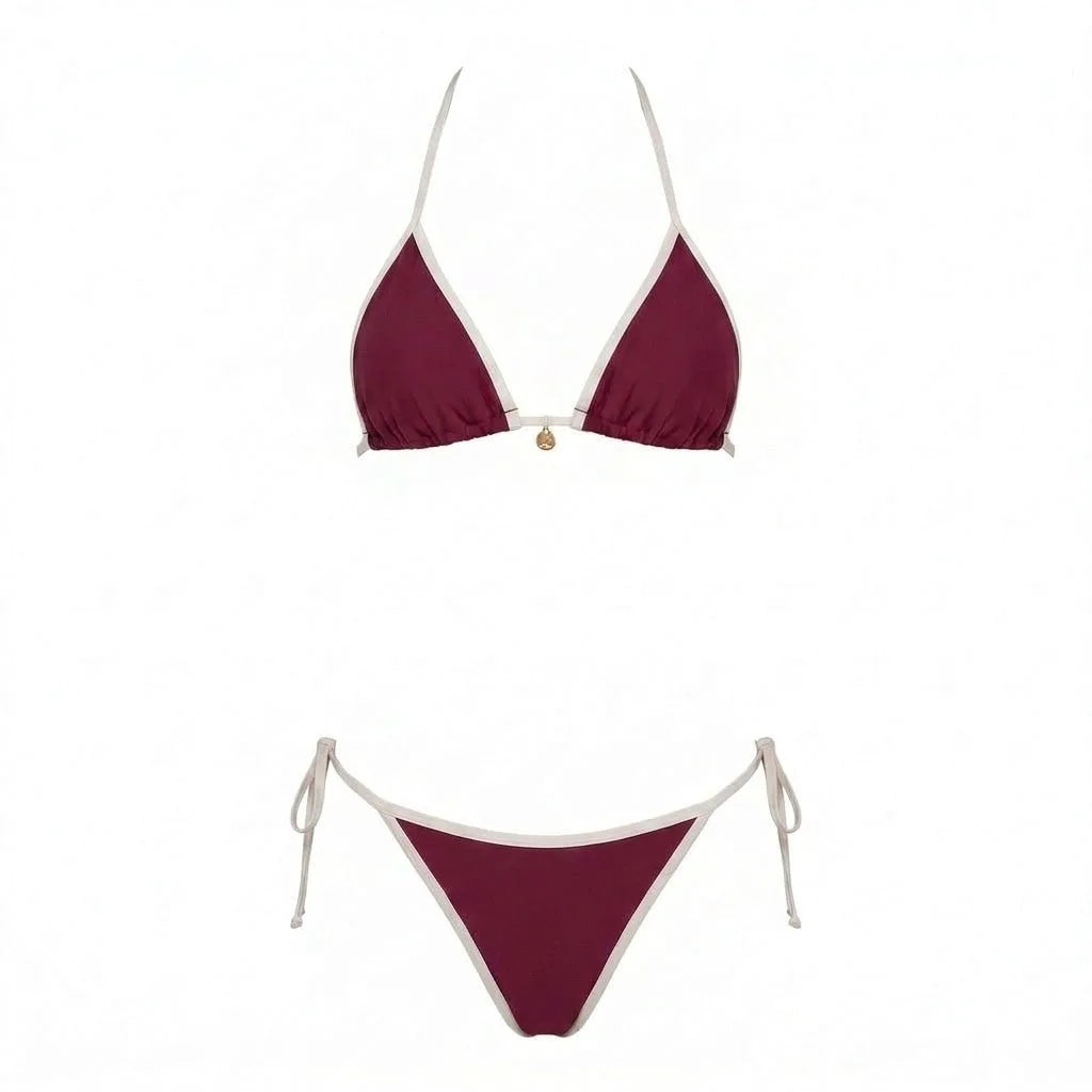Flat lay of navy bikini set laid out showing full coverage and binding detail