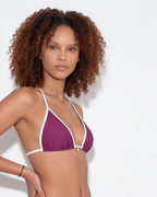 Close-up of the halter tie at the back of the neck on the navy bikini top