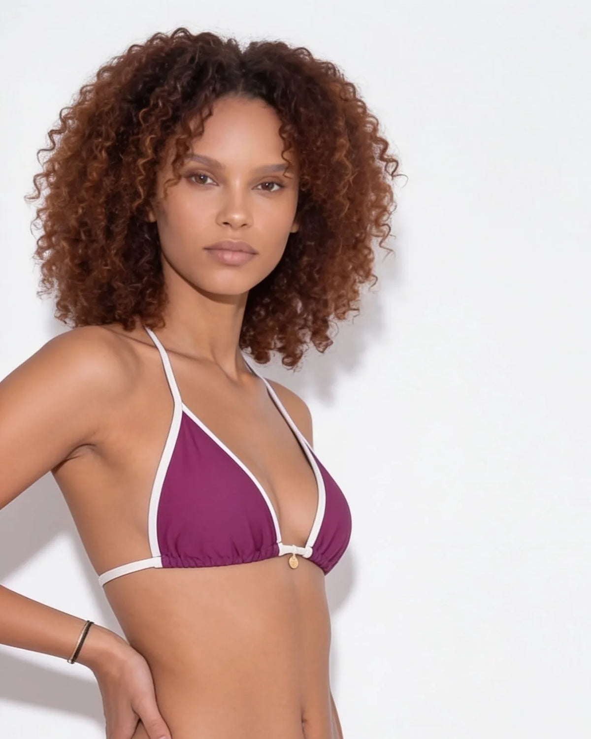 Close-up of the halter tie at the back of the neck on the navy bikini top