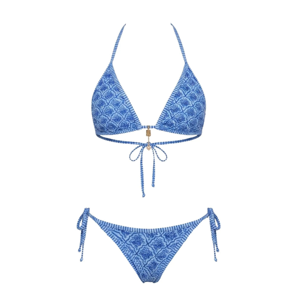 Model wearing navy bikini bottoms showing the rise and coverage at the front