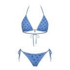 Model wearing navy bikini bottoms showing the rise and coverage at the front