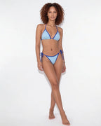 Side view of model in brown bikini showing the tie-side bottom and leg line