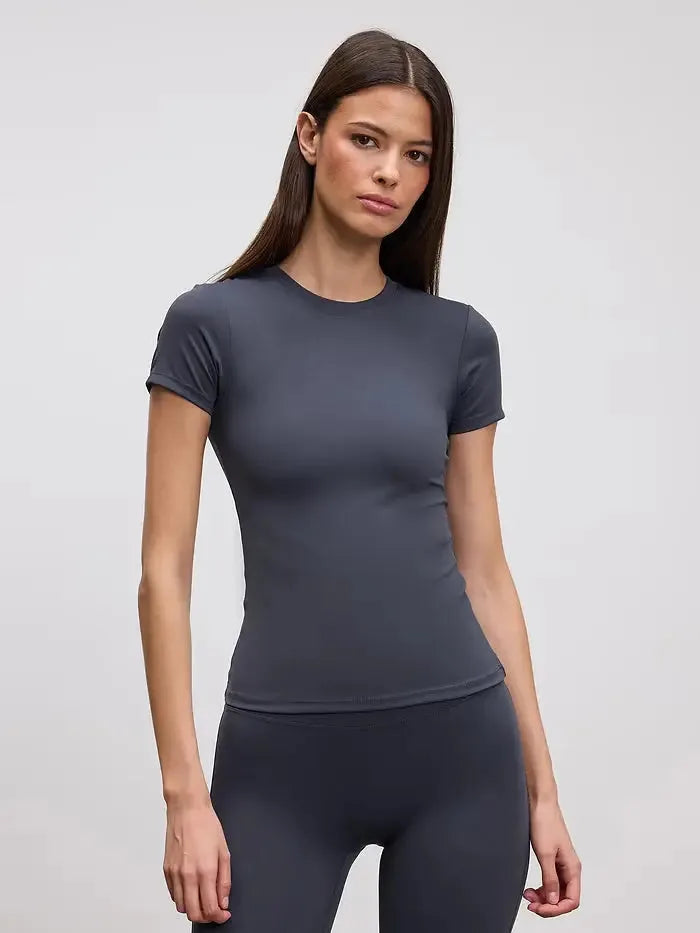 Fitted charcoal grey crew neck tee paired with matching dark grey leggings, front facing pose