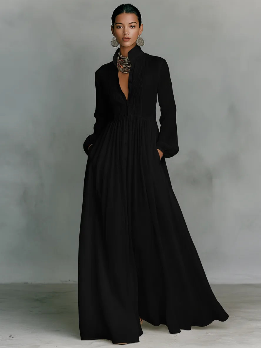 Black maxi shirt dress with button-front bib, standing collar and long sleeves on a model
