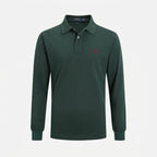 Close-up of the classic polo collar and partial button placket with embroidered brand label