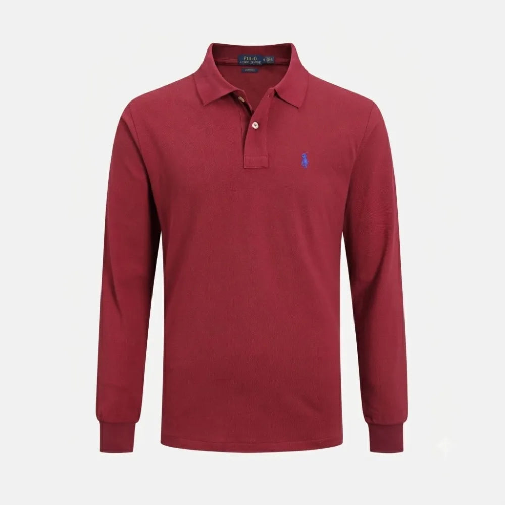 Flat lay detail of the embroidered pony logo on the chest of the polo shirt
