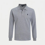 Side angle view of a long-sleeve polo shirt highlighting the fitted silhouette and collar shape