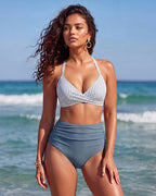 Close-up of the striped bikini top clasp and adjustable straps against tanned skin at the beach