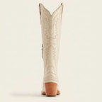 Top view of pink cowboy boots showing the cut-out topline and tan leather lining