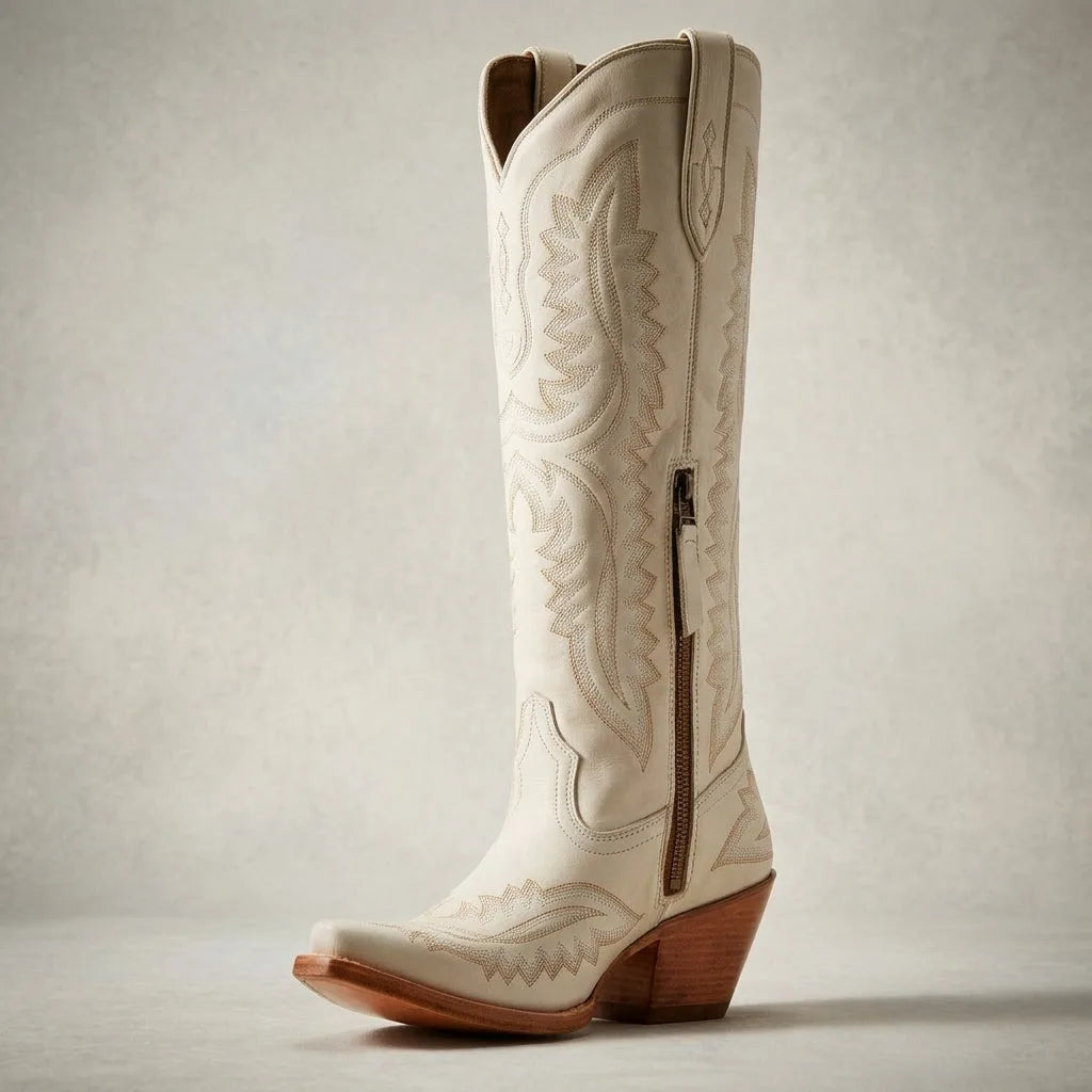 Close-up of the toe box and sole stitching on a red leather cowboy boot