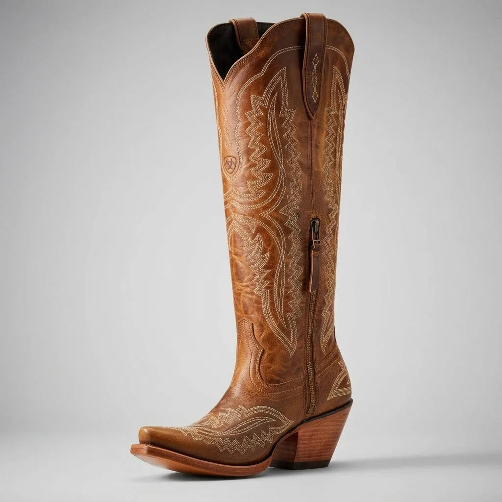 Three-quarter view of a red leather cowboy boot showing the full knee-high shaft and tonal embroidery