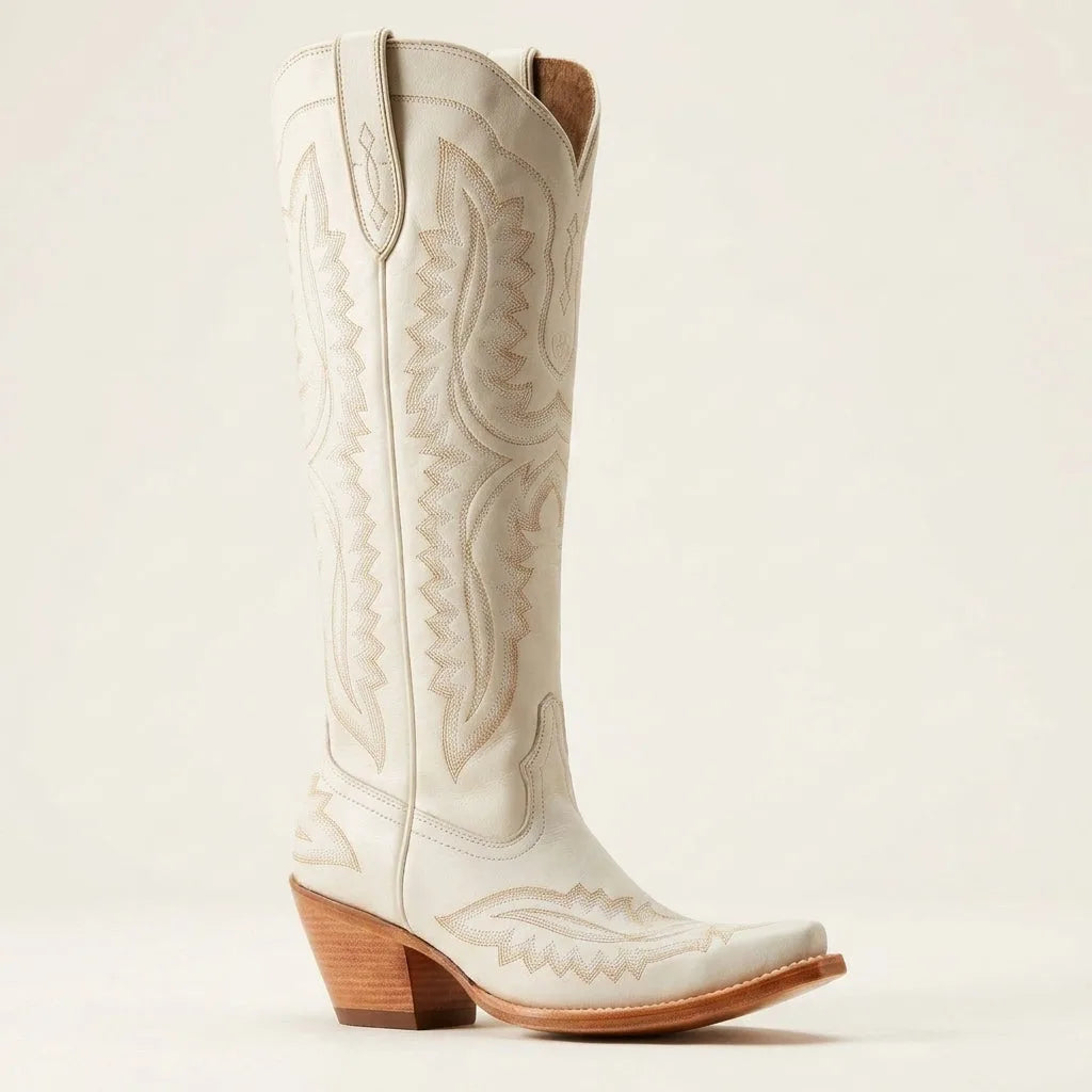Single white leather knee-high cowboy boot with tonal tan embroidery and a wooden stacked heel