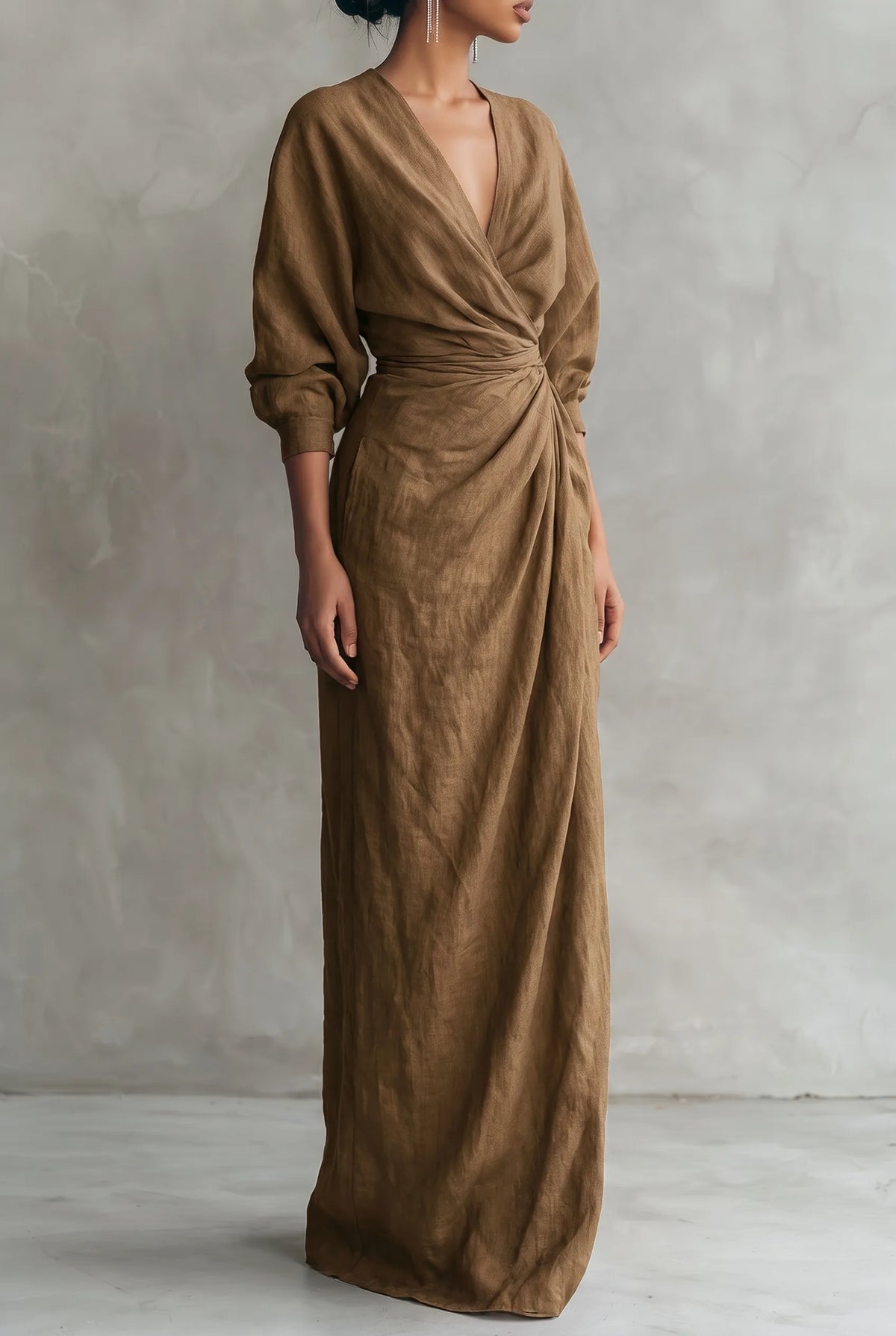 Front view of the maxi dress in an earthy brown tone, showing the draped bodice and floor-length column skirt