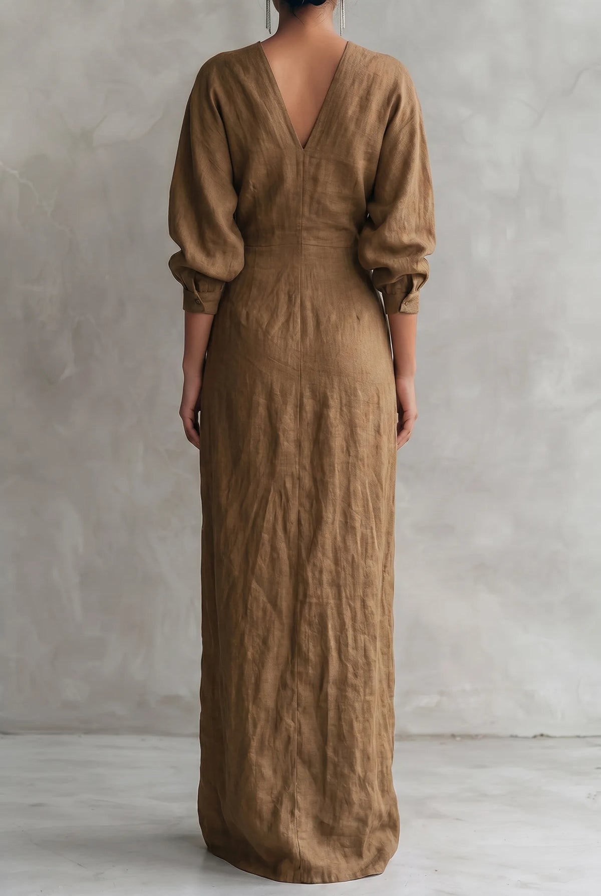 Back view of the brown dress showing the deep V-back, waist seam and tie fastening at the back