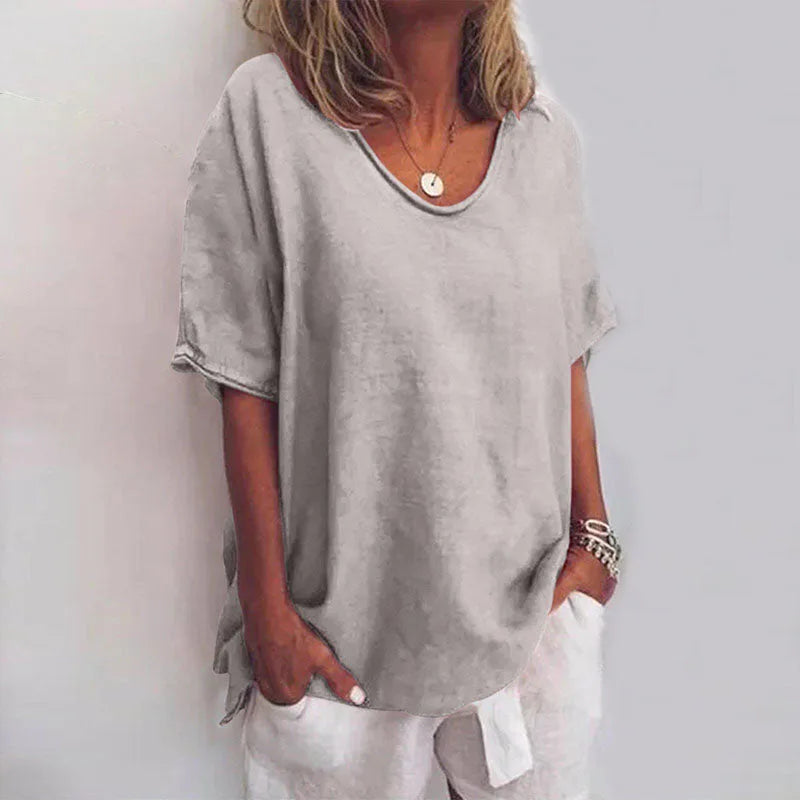 Front view of the same relaxed-fit t-shirt in light grey, showing the loose drape over the hips