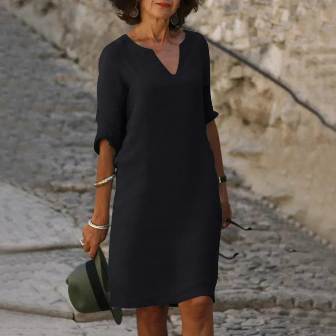 Black linen-look shift dress with notched V-neck and turned-up half sleeves, front view on model