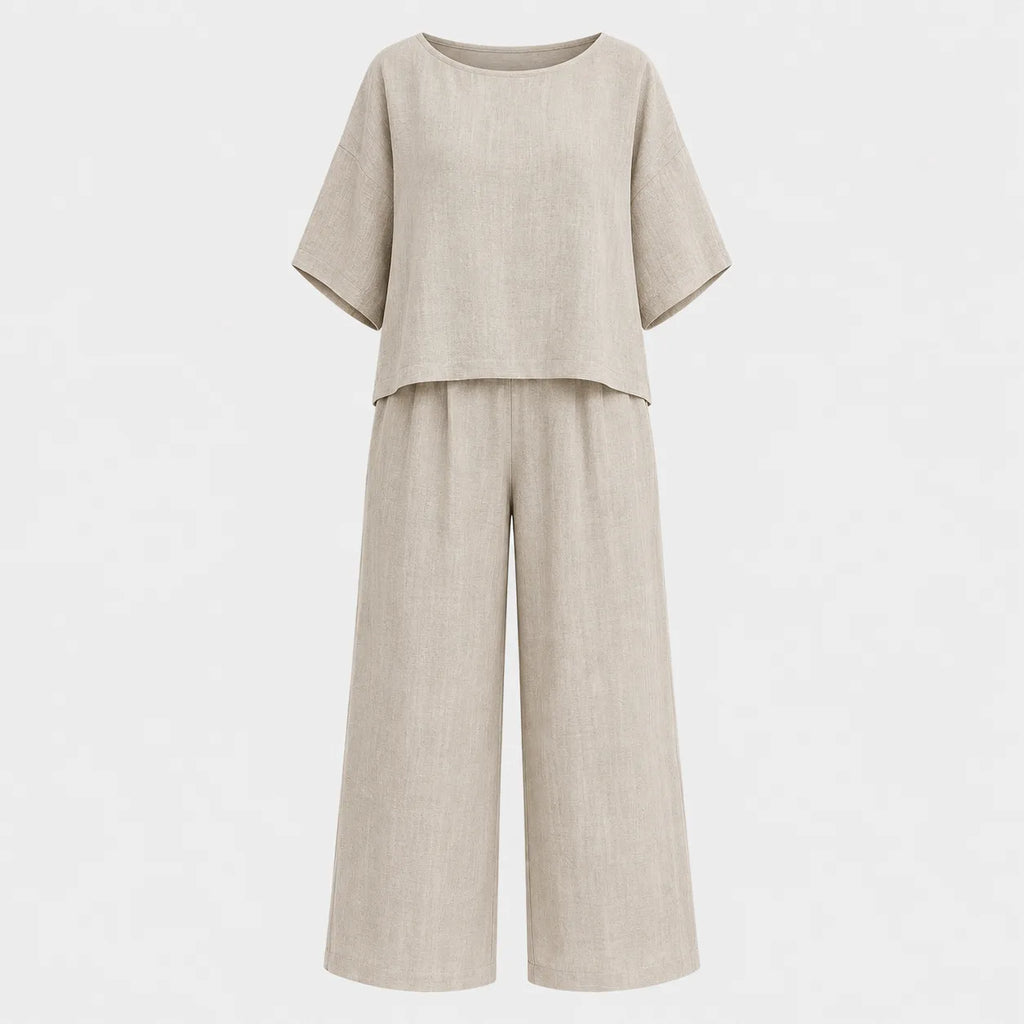 Flat lay of the grey marle relaxed top and wide leg trouser set shown on a mannequin form against a plain background