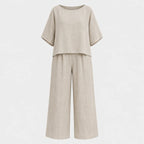 Flat lay of the grey marle relaxed top and wide leg trouser set shown on a mannequin form against a plain background