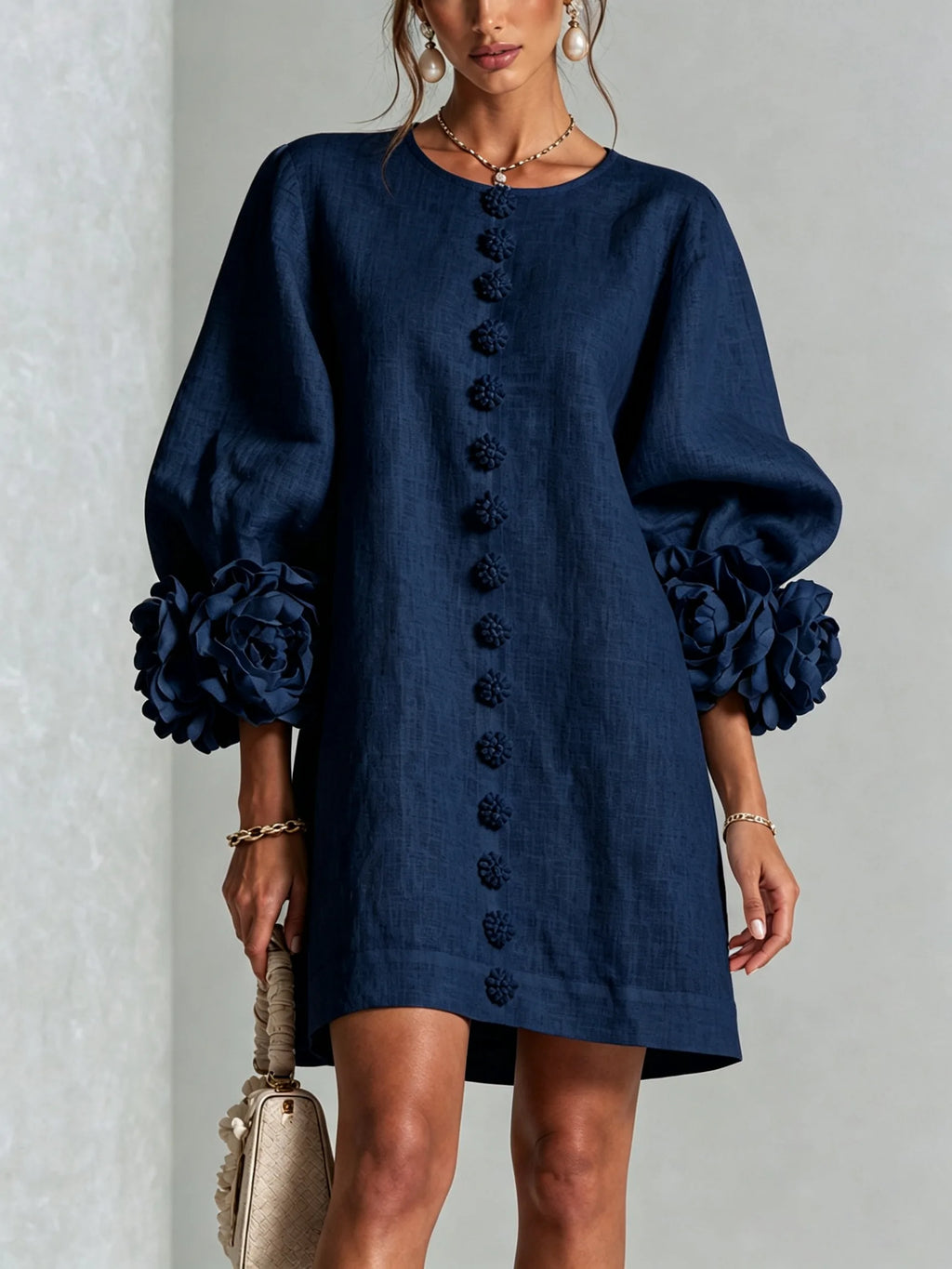 Full front view of the white mini dress showing its A-line shift shape and knee-skimming length
