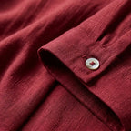 Flat lay of a relaxed-fit linen short-sleeve shirt highlighting the breathable woven fabric and clean silhouette