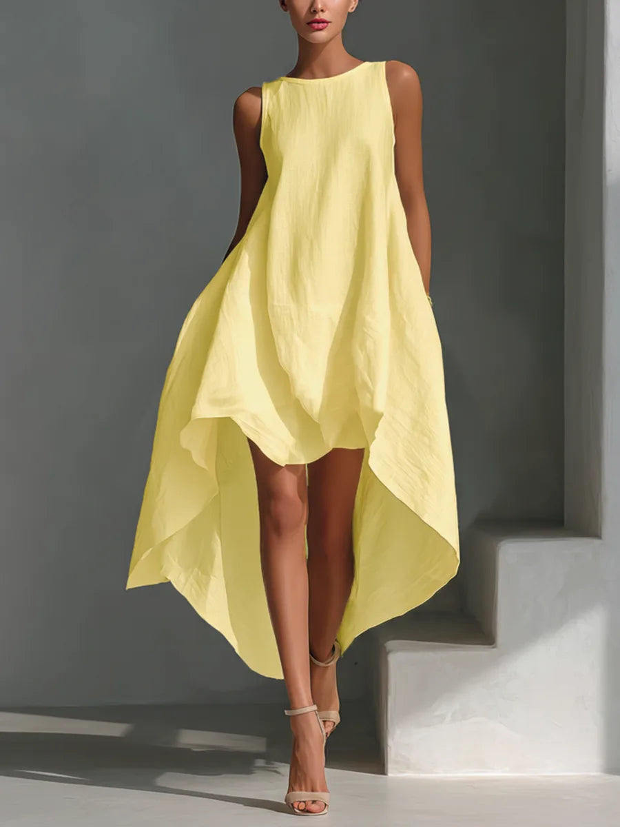 Close-up of the sleeveless white linen dress bodice with round neckline and soft linen texture
