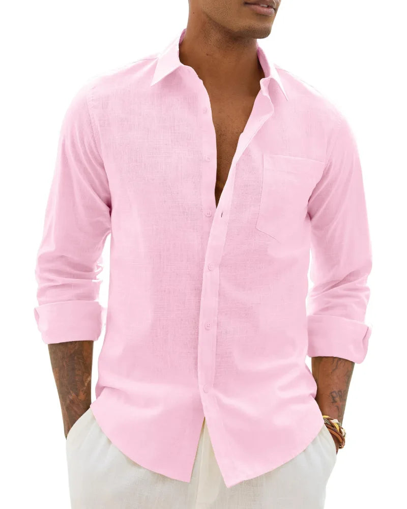 Close-up of pale pink textured linen-cotton shirt, unbuttoned at the neck with chest pocket detail