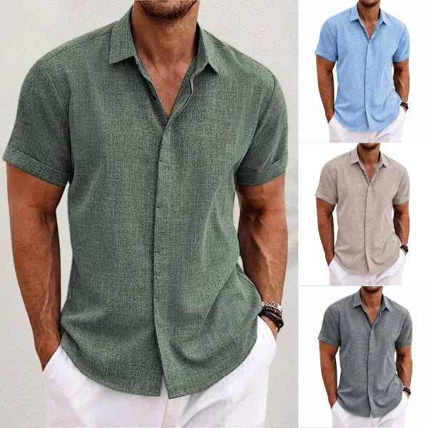 Four colourways shown together: army green, light blue, khaki and grey short-sleeve shirts with rolled cuffs