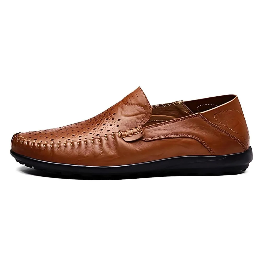 Side profile of a brown leather loafer showing its low-cut silhouette and flat rubber sole