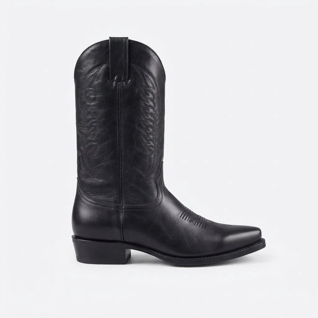 Side profile of a black leather cowboy boot with pull tab and full western stitching on the tall shaft
