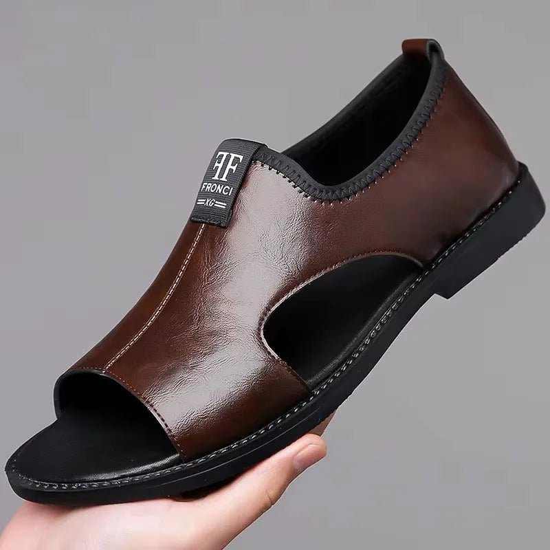 Brown leather sandal, side angle, showing cut-out panel and FRONCI logo badge on heel strap.