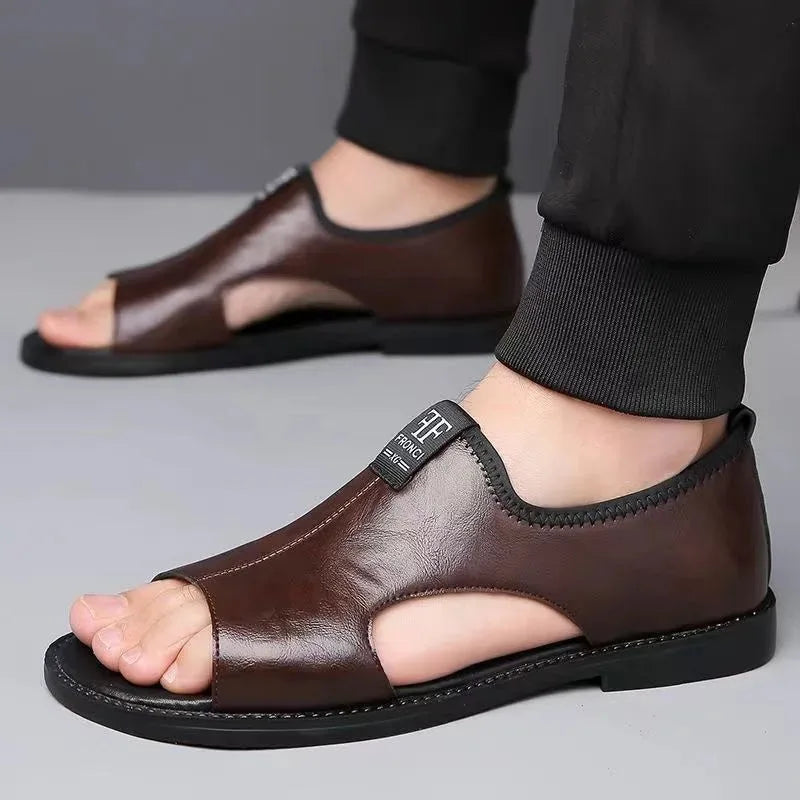Brown leather sandal worn on foot, side view showing cut-out side panel and stitched sole.