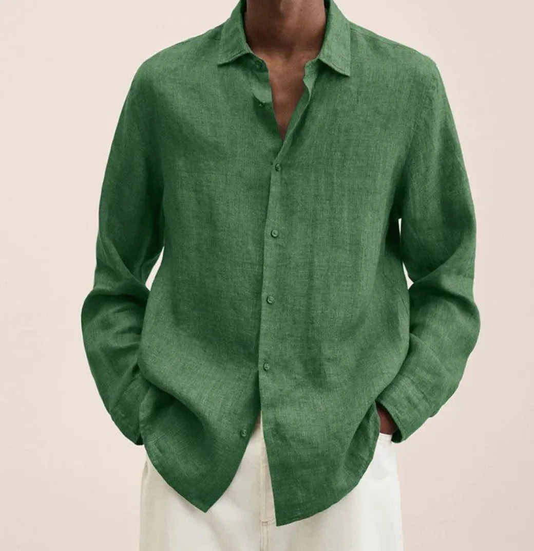 Side angle view of a linen shirt sleeve showing the loose cuff and rolled-up styling