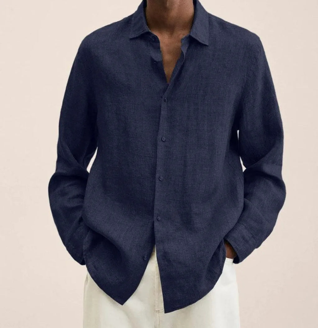 Close-up of a dark navy linen shirt showing the visible woven texture and button placket detail