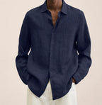 Close-up of a dark navy linen shirt showing the visible woven texture and button placket detail