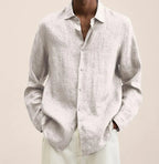 Front view of a light beige linen shirt showing the soft natural fabric texture and relaxed fit