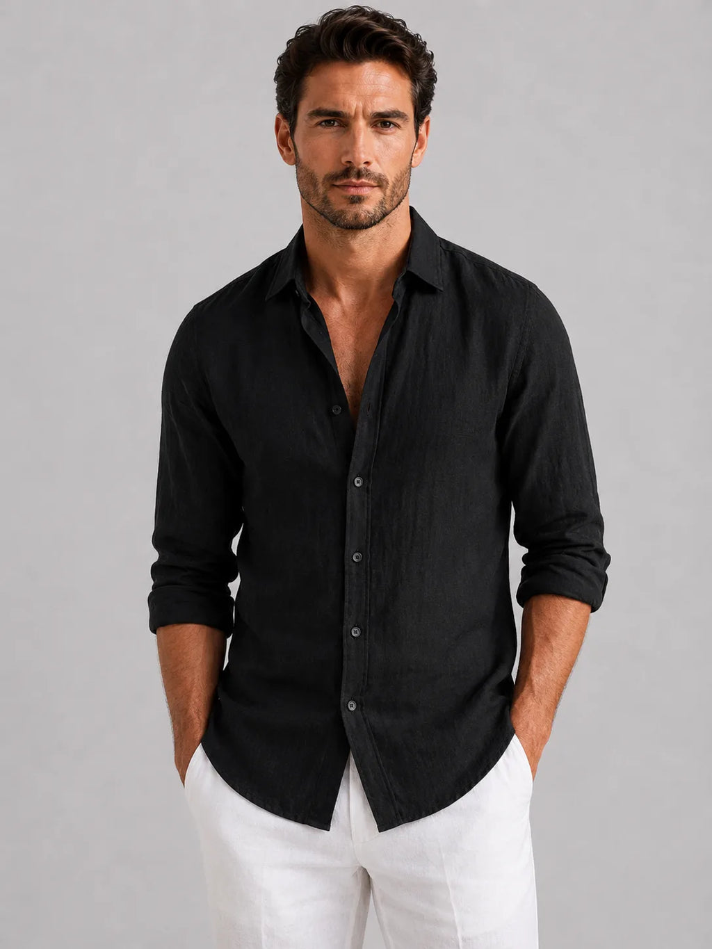 Front view of a man in an open-collar linen-look shirt showing the point collar and mother-of-pearl style buttons