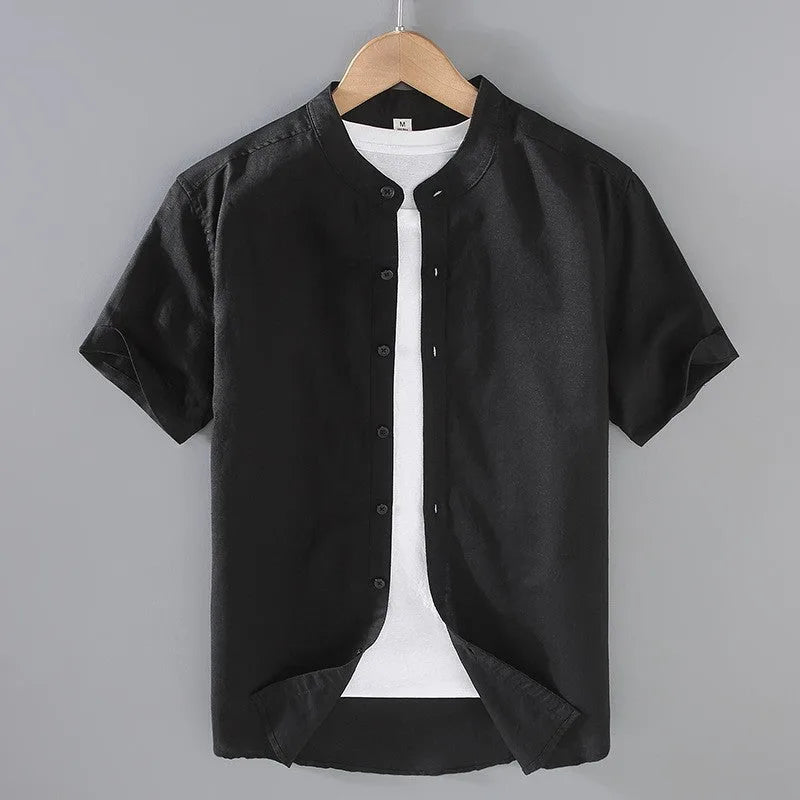 Ivory linen short sleeve shirt on a hanger highlighting the textured woven fabric and clean back yoke