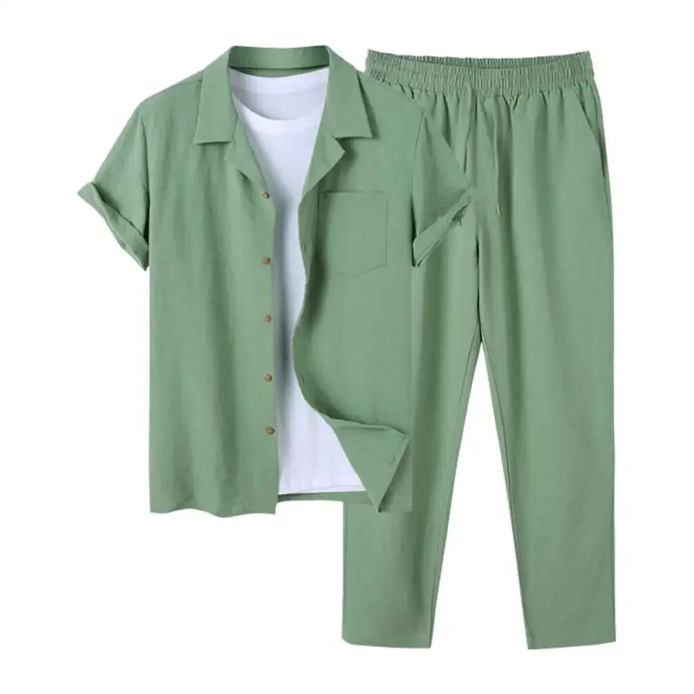 Sage green linen two-piece set with camp collar shirt and drawstring trousers, worn over a white t-shirt