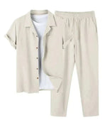 Stone beige linen short-sleeve shirt and elastic-waist trousers set, styled with a white t-shirt underneath