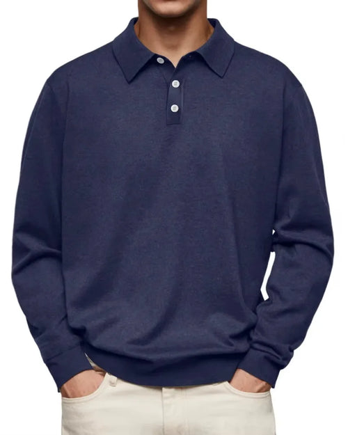 Front view of man wearing navy heathered long-sleeve polo jumper with three-button placket and pointed collar