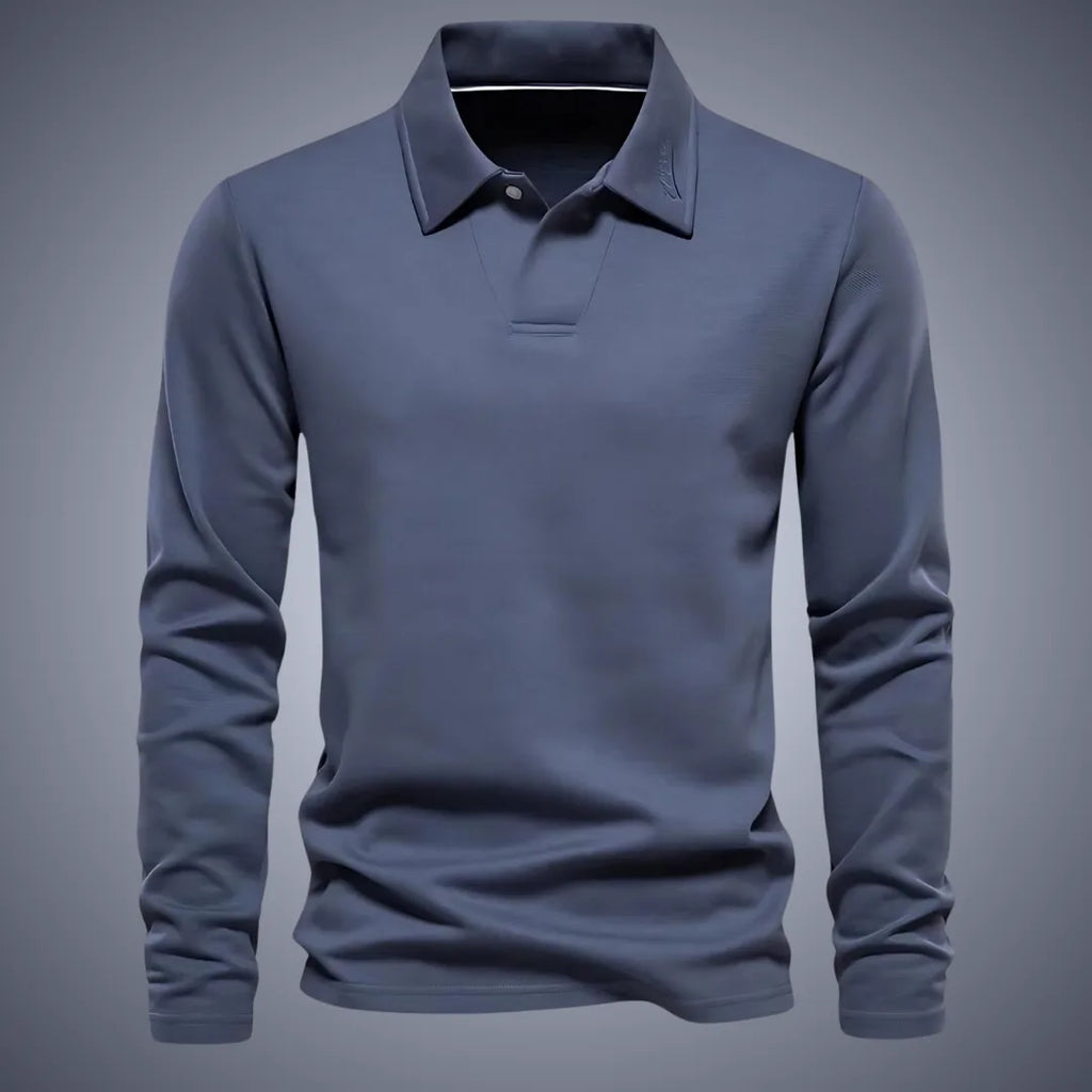 Slate blue long-sleeve polo shirt, front view, showing ribbed collar, button placket and embroidered logo detail