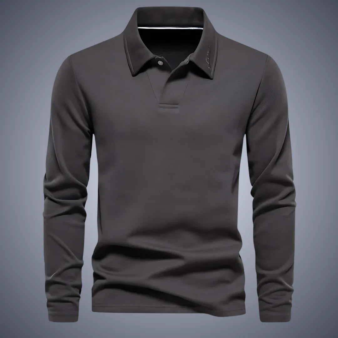 Dark grey long-sleeve polo shirt, front view, showing the structured collar and subtle chest embroidery