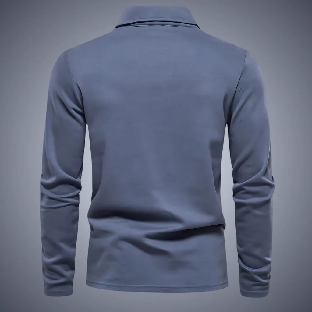 Back view of slate blue long-sleeve polo shirt, showing the smooth yoke and clean seam finishing