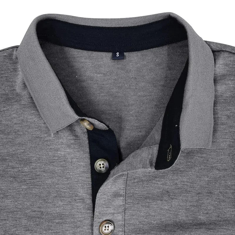 Man standing with hands near pockets wearing the olive green long-sleeve polo shirt