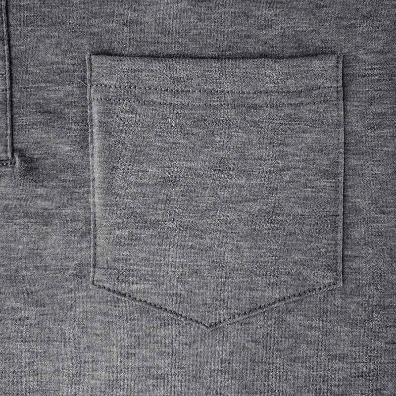 Detail shot of the button fastening and ribbed collar on the burgundy polo shirt