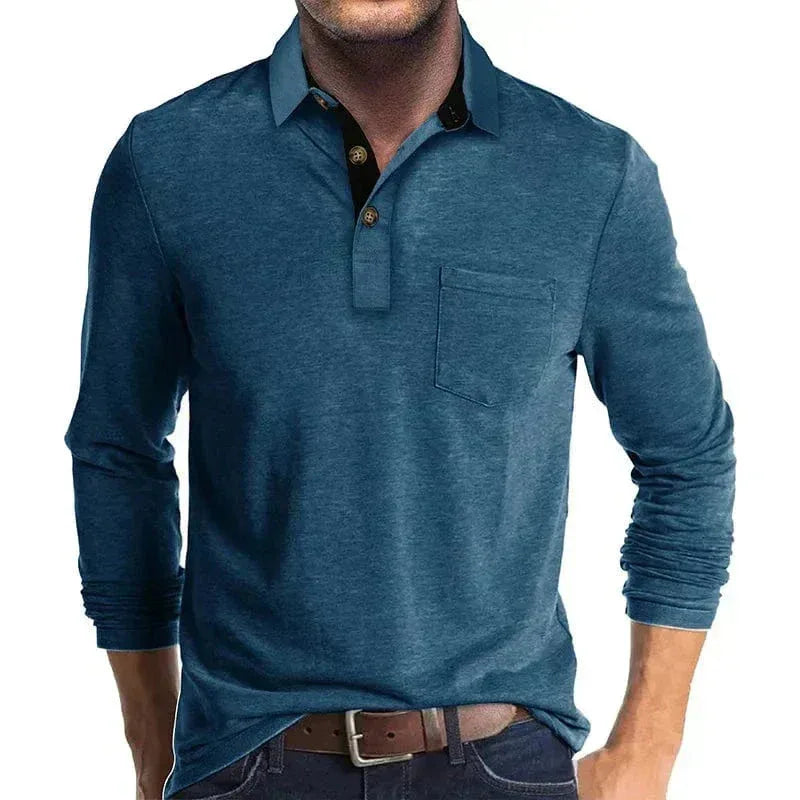 Man modelling a teal blue long-sleeve polo shirt with contrast collar and buttoned placket, paired with jeans